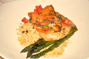 baked fish, asparagus, and rice entree
